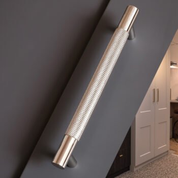Textured metallic wall light in modern interior setting.