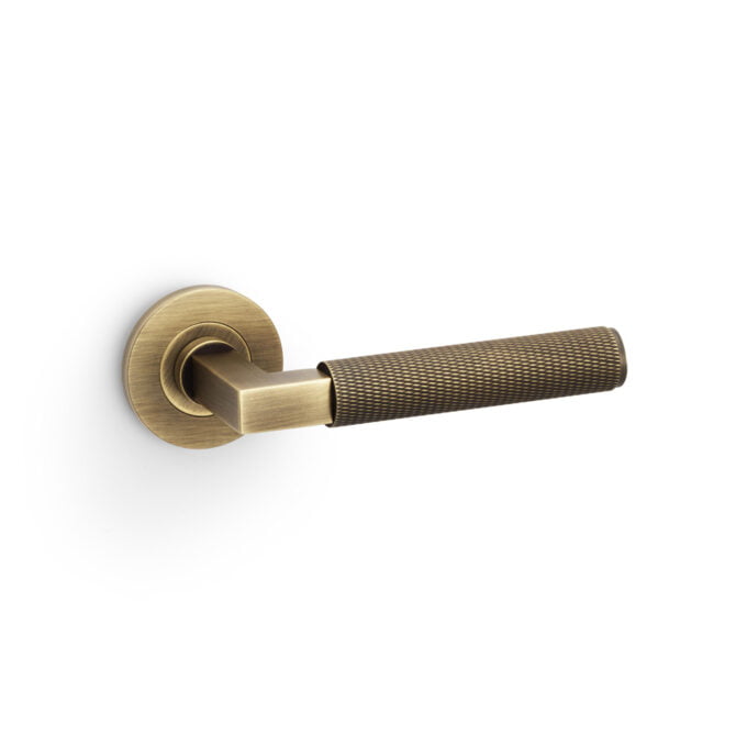 Bronze door lever on white background.