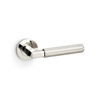 Chrome door handle with textured grip on white background.