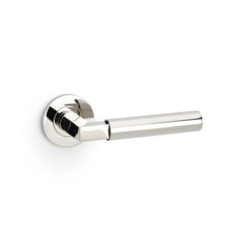 Polished chrome door handle on white background.