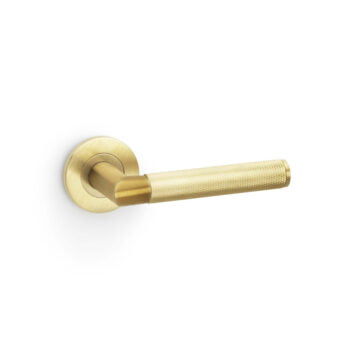 Brass door handle on white background.