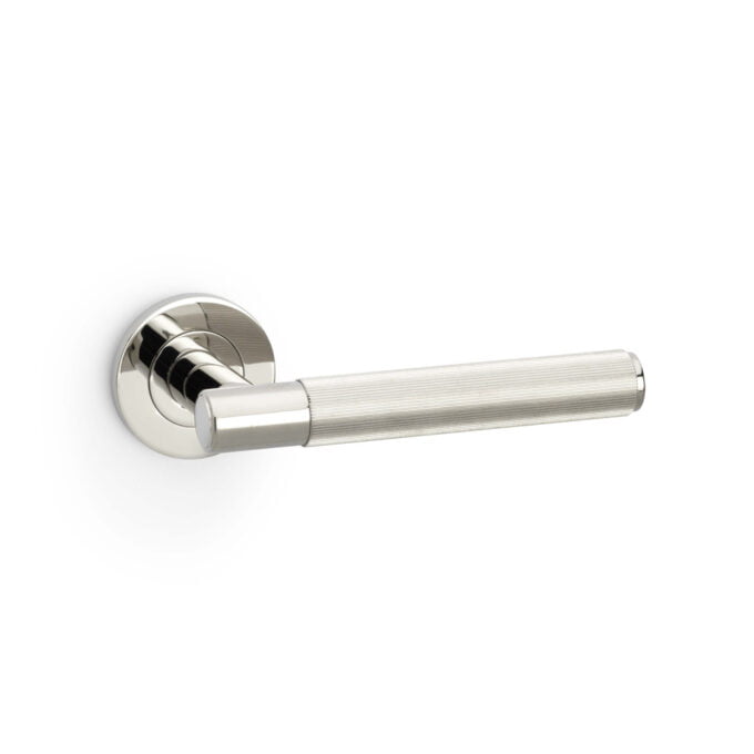 Modern satin chrome door handle on white background.