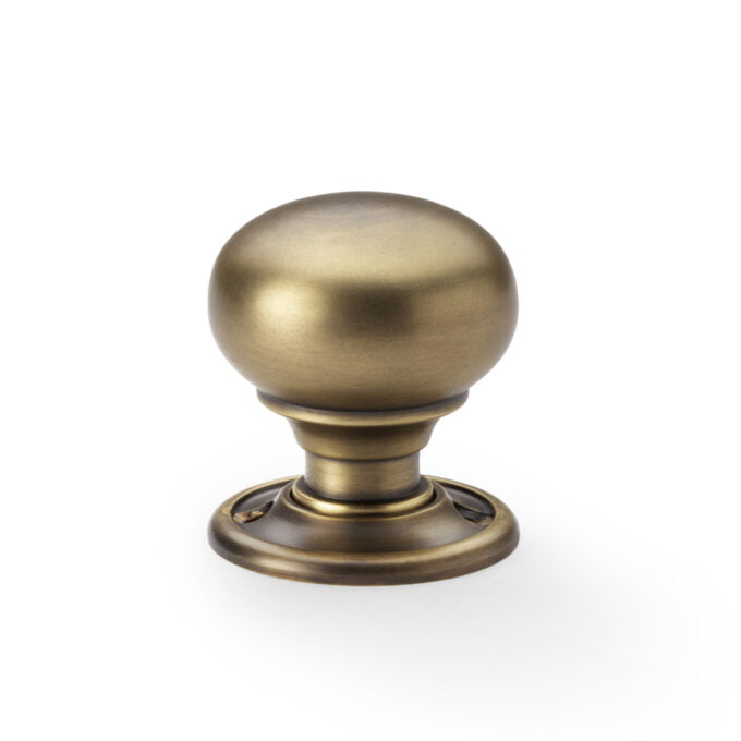 Antique brass door knob isolated on white background.