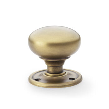 Antique brass door knob isolated on white background.