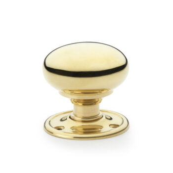 Brass door knob with contrasting black stripe.