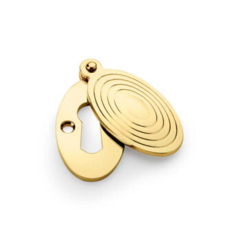 Gold circular door latch on white background.