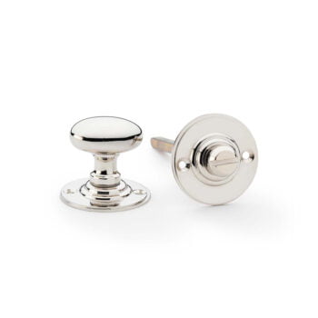 Polished chrome cabinet knobs on white background.