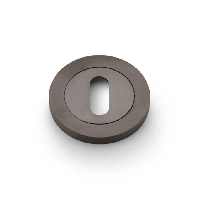 Metallic grey washer with central hole, isolated on white