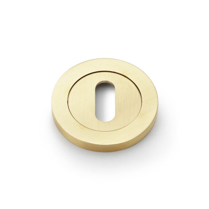 Gold escutcheon plate on white background.