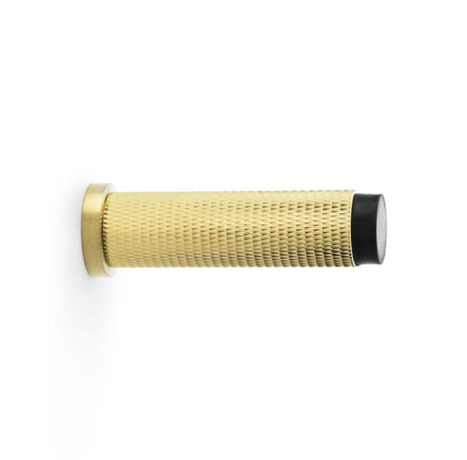 Gold textured flashlight on white background.