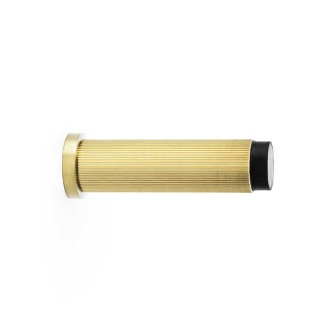 Gold ribbed metal handle isolated on white background.