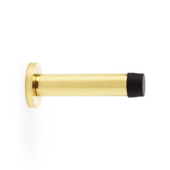 Gold doorstop with black rubber tip on white background.