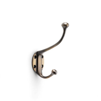 Single brass hook on white background.