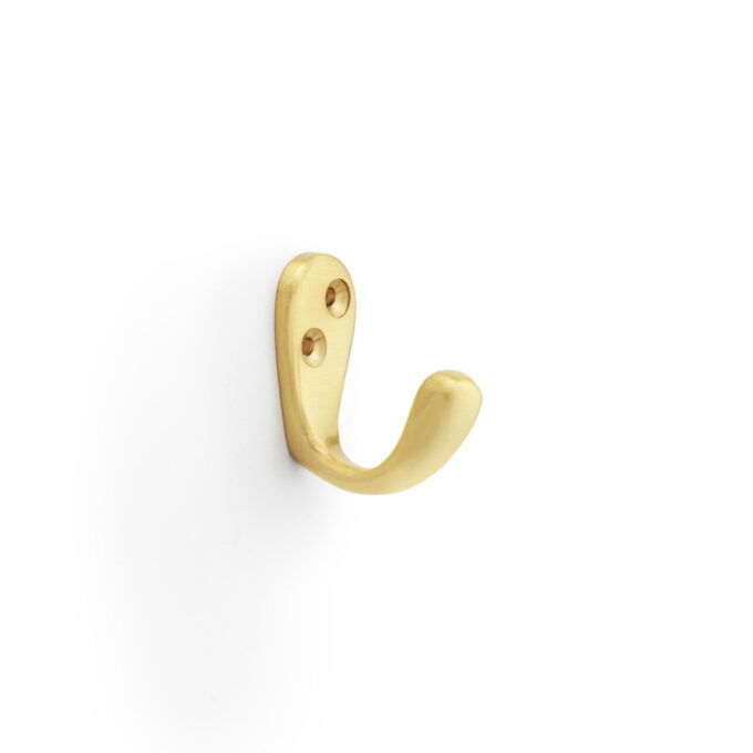 Gold wall hook on white background.