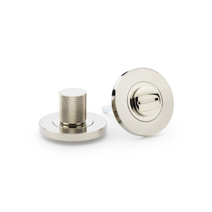 Chrome door knobs on white background.