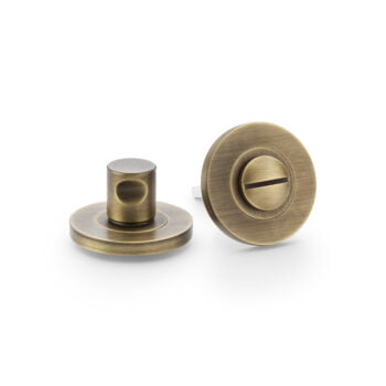 Antique bronze door knobs on white background.