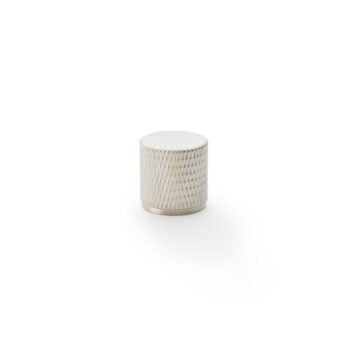 White textured ceramic jar on a plain background.