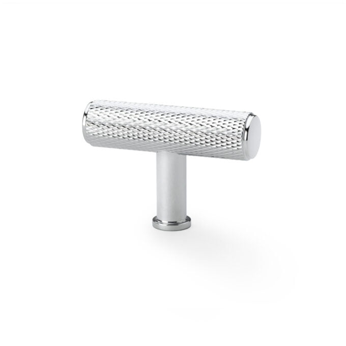 Metal knurled cabinet handle isolated on white.