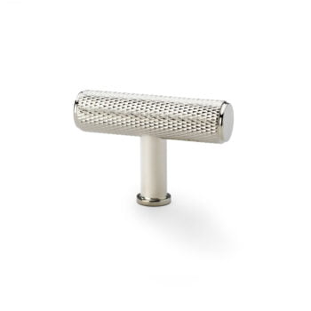 Knurled metal cabinet handle on white background.