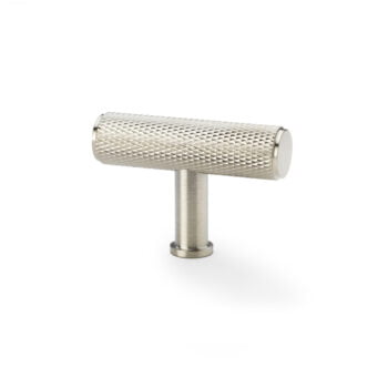 Knurled stainless steel cabinet handle on white background.