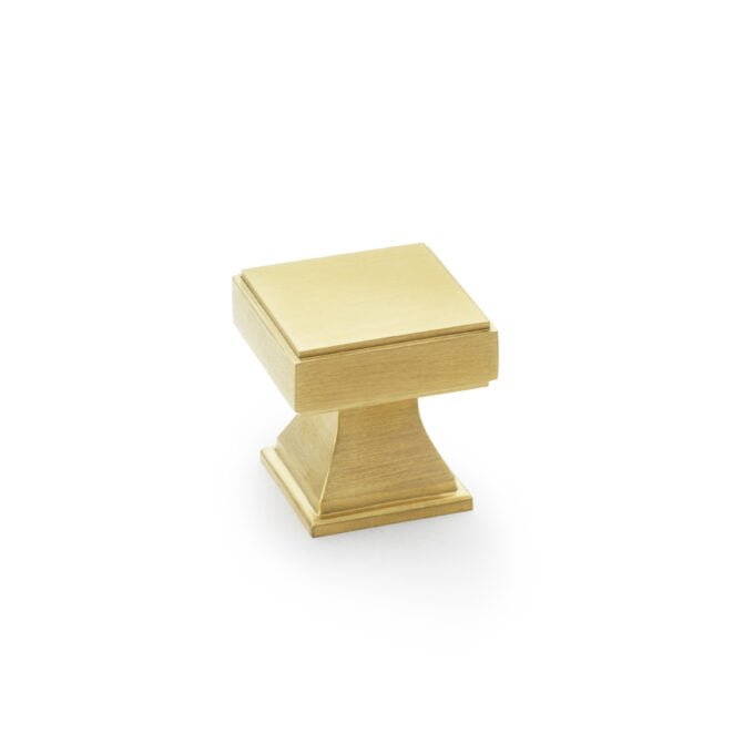 Gold rectangular pedestal display stand on white background.