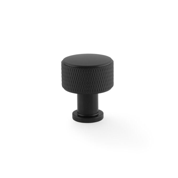 Black textured knob on white background.