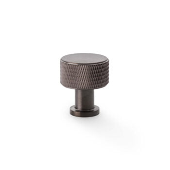 Bronze textured cabinet knob on white background.