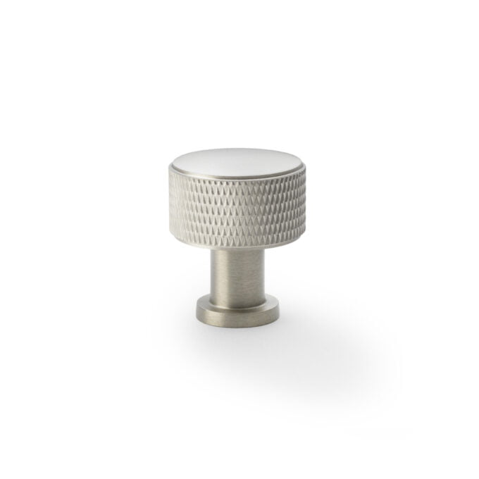 Silver textured knob on white background