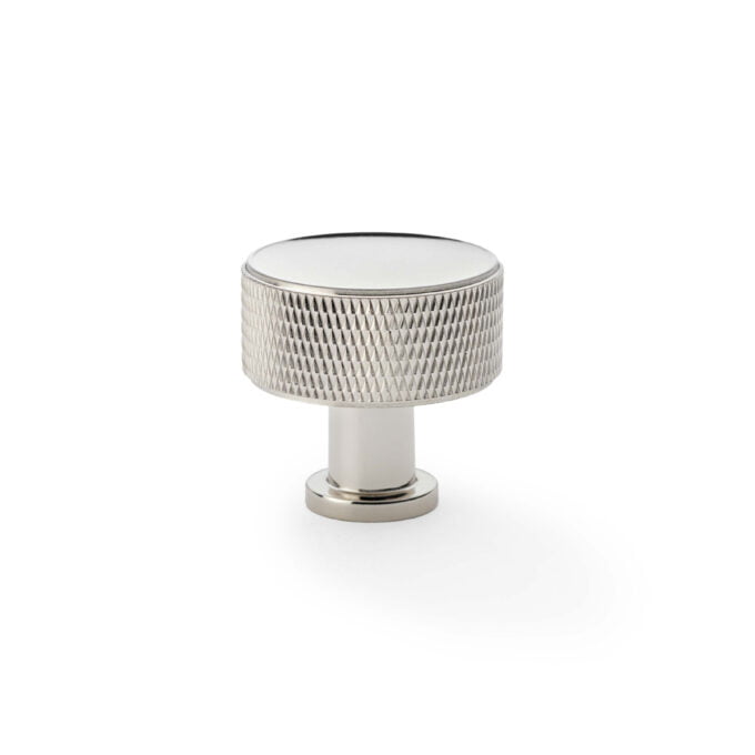 Silver textured cabinet knob on white background