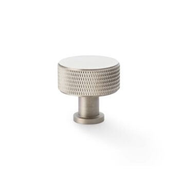 Brushed nickel cabinet knob on white background.