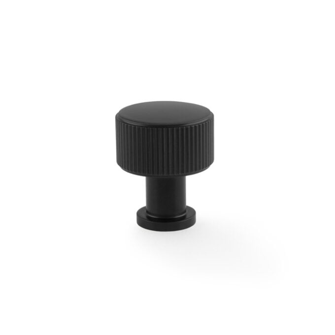 Black ridged knob on white background.