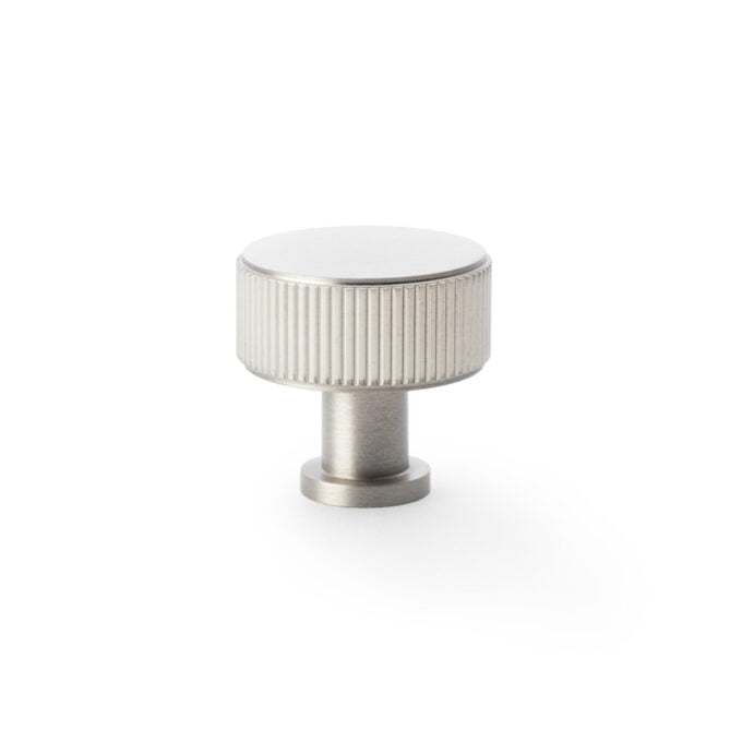 Silver ribbed cabinet knob on white background