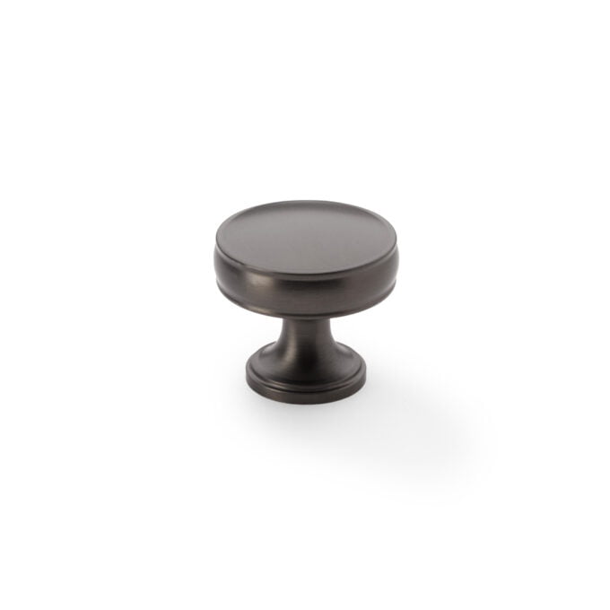 Black metal cabinet knob on white background