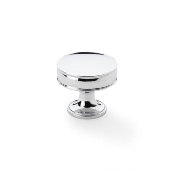 Polished chrome cabinet knob on white background