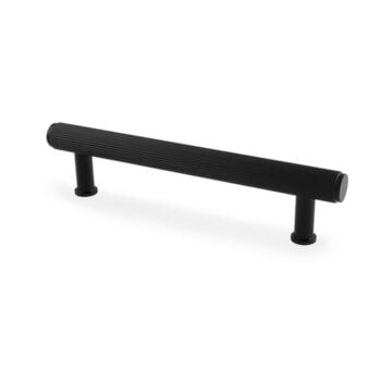 Black textured cabinet handle on white background