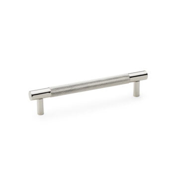 Chrome cabinet handle with textured grip on white.