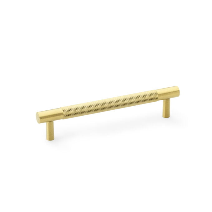Gold textured cabinet handle isolated on white background.