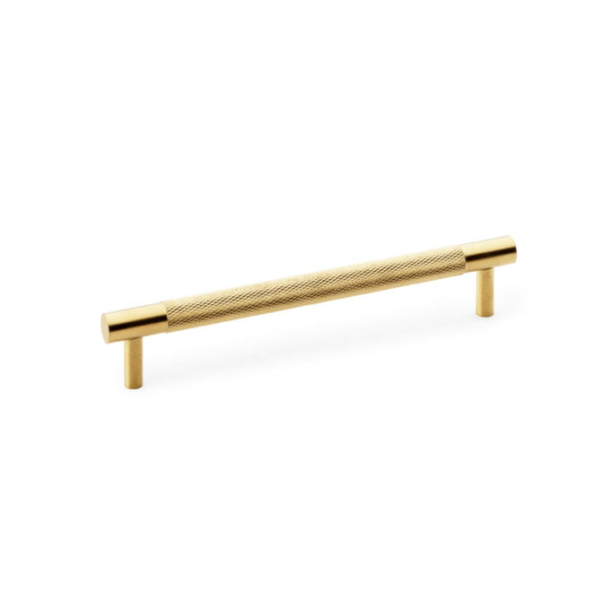 Brass textured cabinet handle on white background.