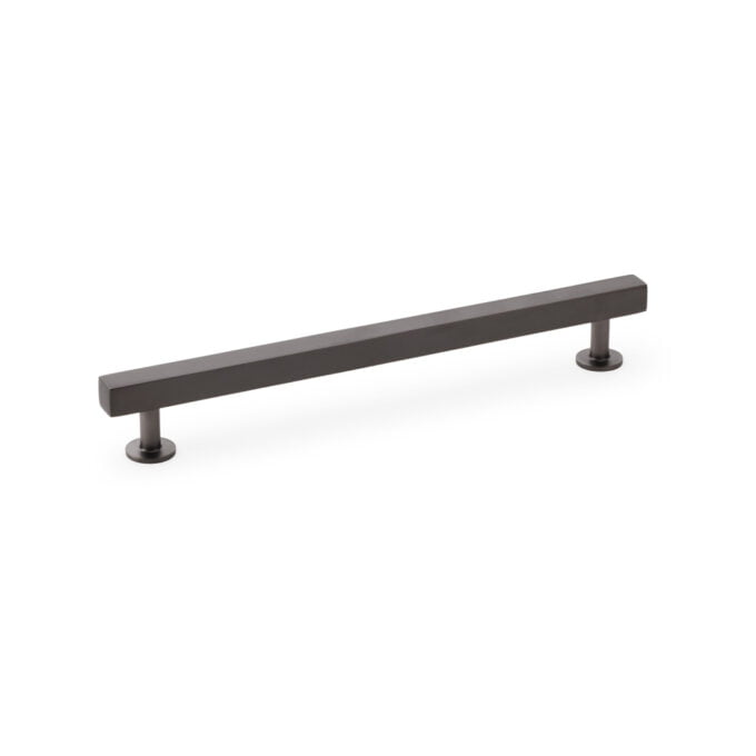 Modern dark grey cabinet handle isolated on white.