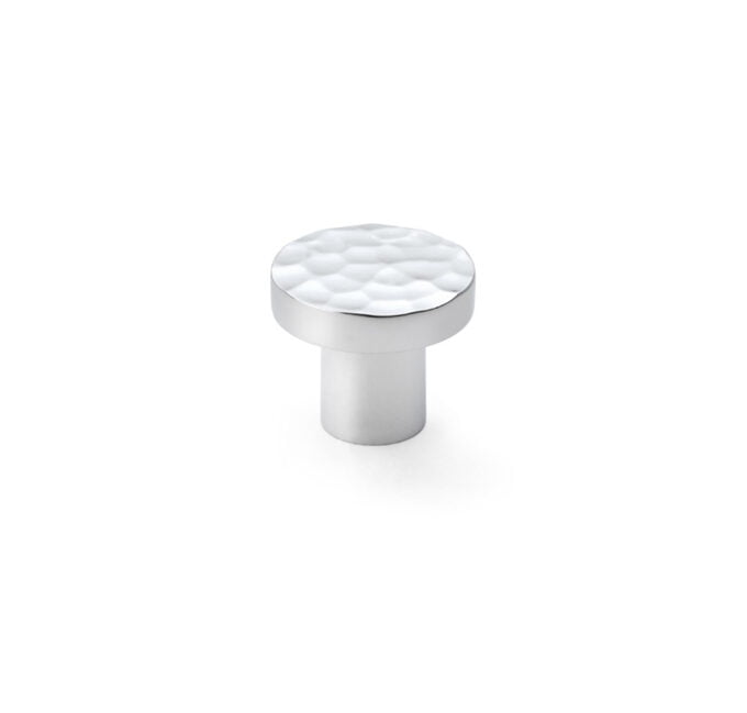 Silver textured cabinet knob on white background.