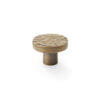 Textured bronze cabinet knob on white background