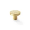 Textured gold cabinet knob on white background