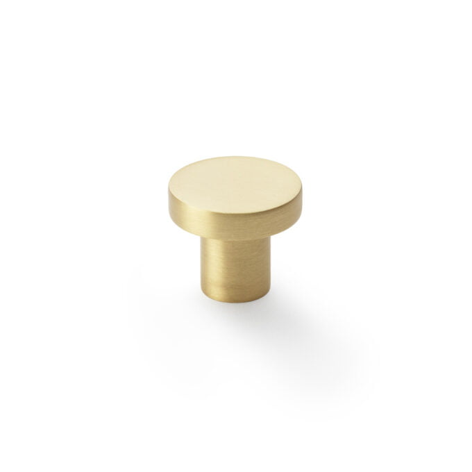 Gold cabinet knob on white background