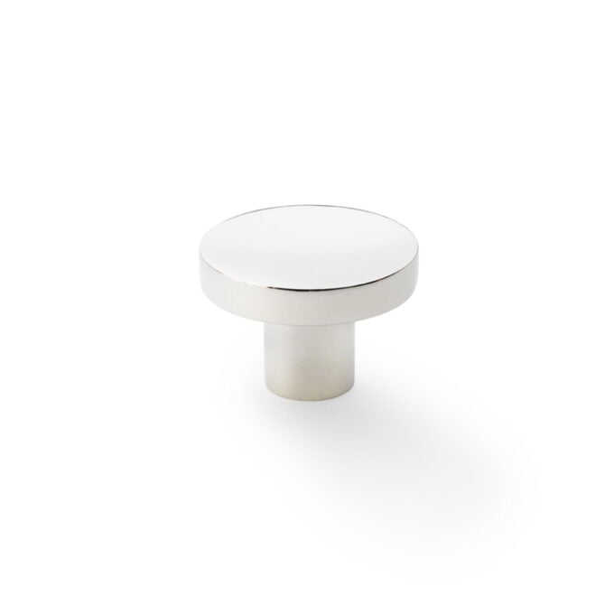 Silver round cabinet knob on white background.