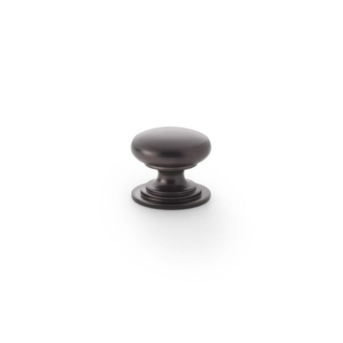 Black cabinet knob on white background.