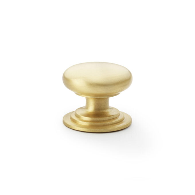 Brass cabinet knob on a white background.