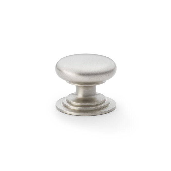 Brushed nickel cabinet knob on white background