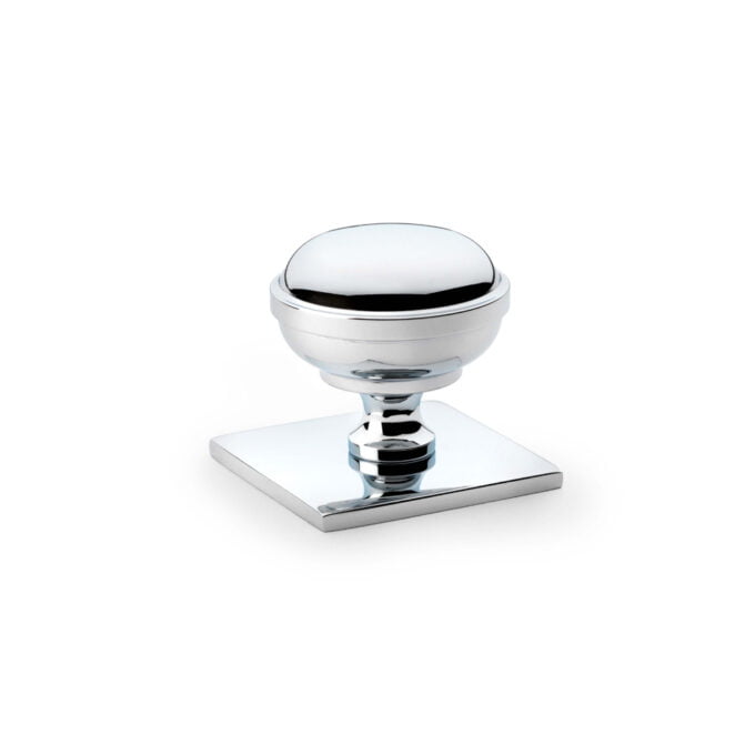 Chrome cabinet knob on square base.