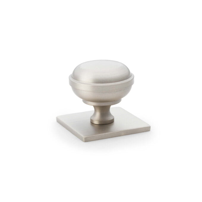 Satin nickel cabinet knob on white background