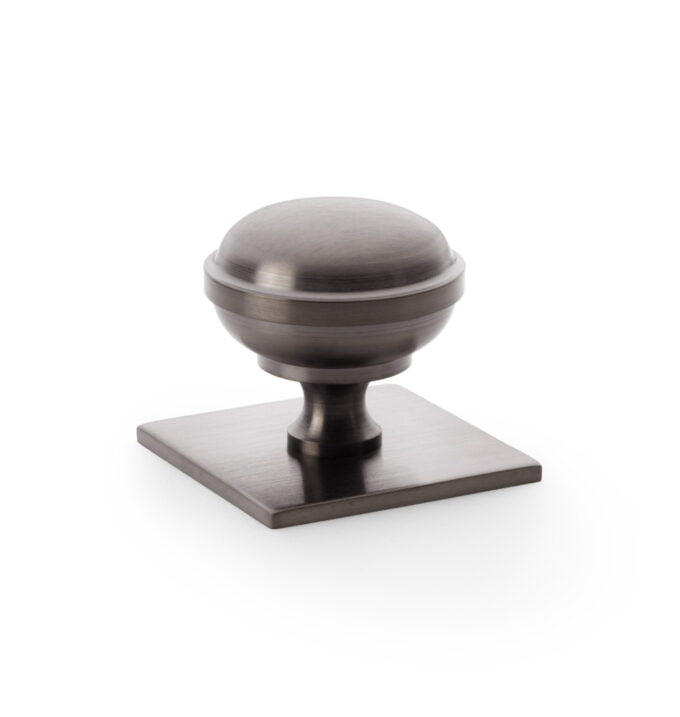 Quantock Cupboard Knob on Square Backplate - Dark Bronze PVD - 38mm cabinet knob on white background.